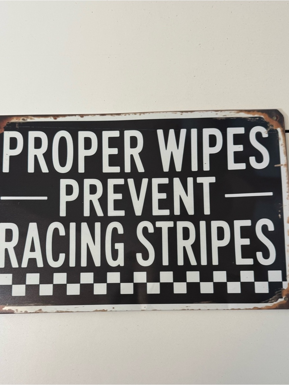 Black and White 'Proper Wipes Prevent Racing Stripes' Decorative Sign